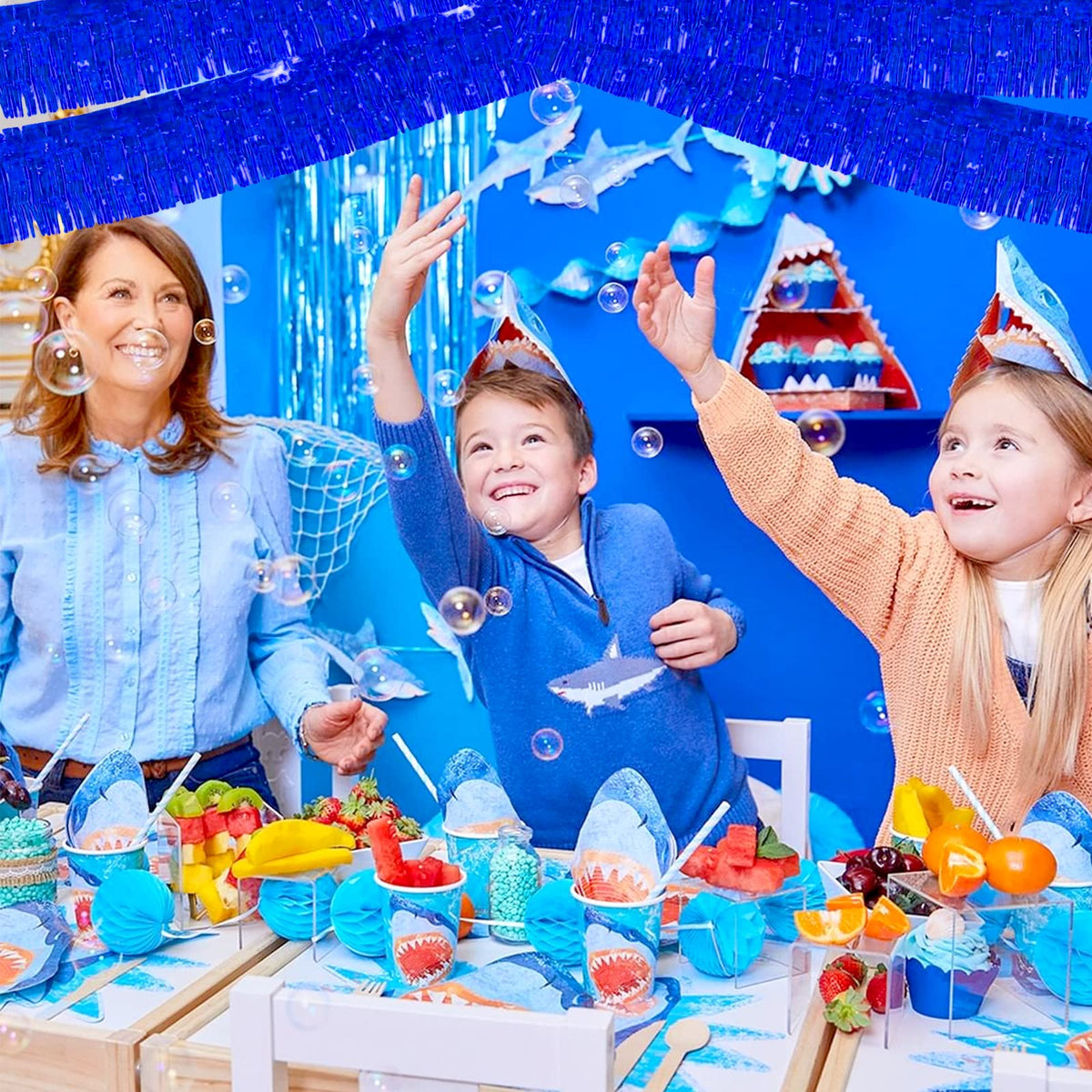 Clayghsen blue fringe garland hangs quickly for fast party setup.
