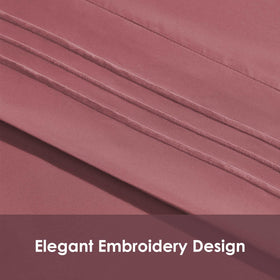 ClevaHome pillowcases on queen set, soft embroidery detail for elegant sleep space.