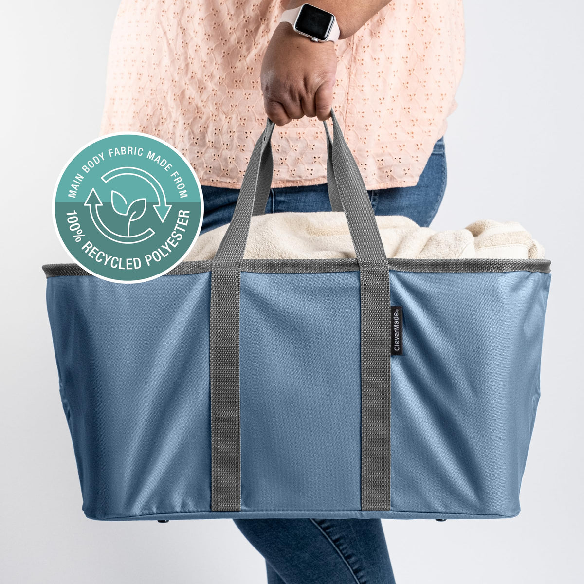 CleverMade collapsible laundry tote denim in dorm room for efficient organization