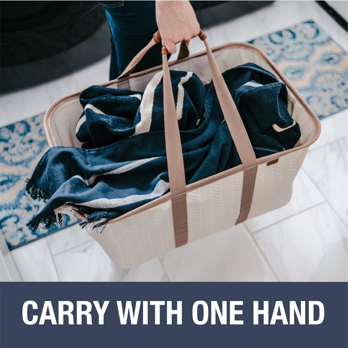 CleverMade Luxe Laundry Tote with long center handles for balanced carrying.