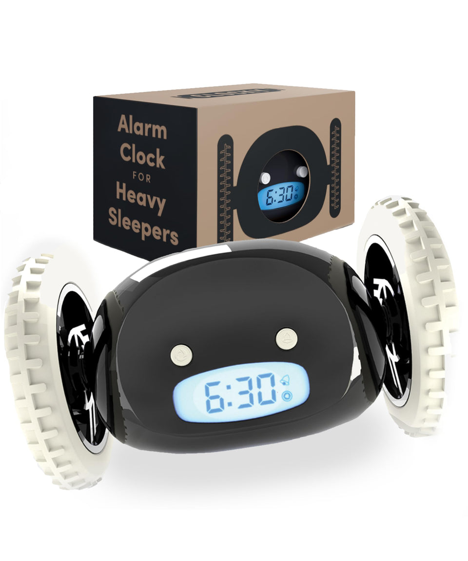 CLOCKY alarm clock on wheels beside the bed, waking you with motion.