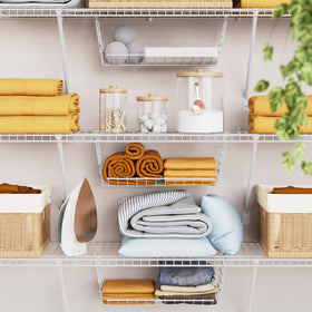 ClosetMaid Hideaway in pantry keeps items behind hangers neatly accessible