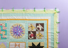 Clip with seam allowance markings to align fabric edges while sewing