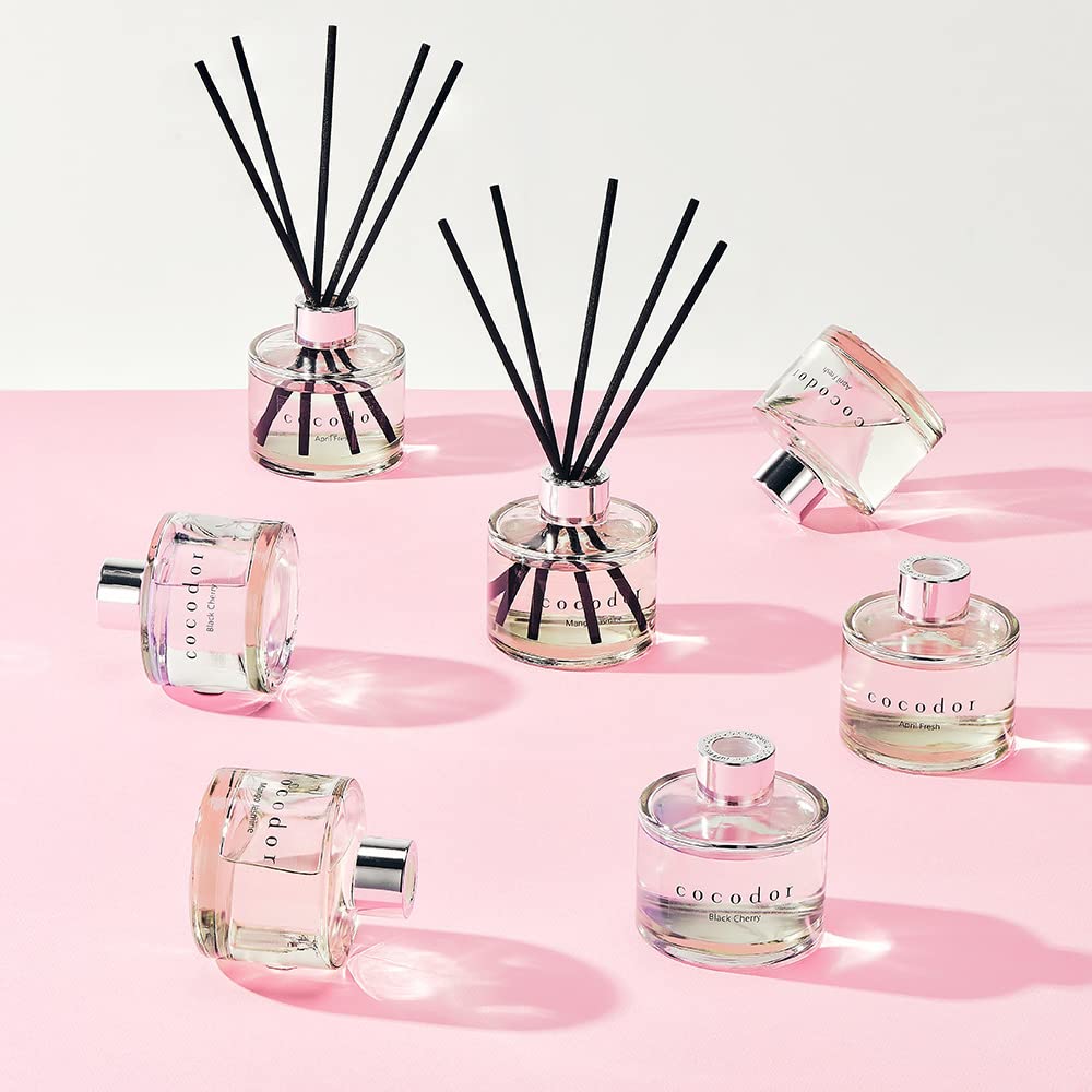Cocod'or Signature Reed Diffuser bottle and sticks on shelf for ambient decor and scent.