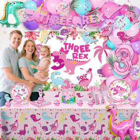 Cocomigo pink dinosaur cake topper crowns the birthday cake