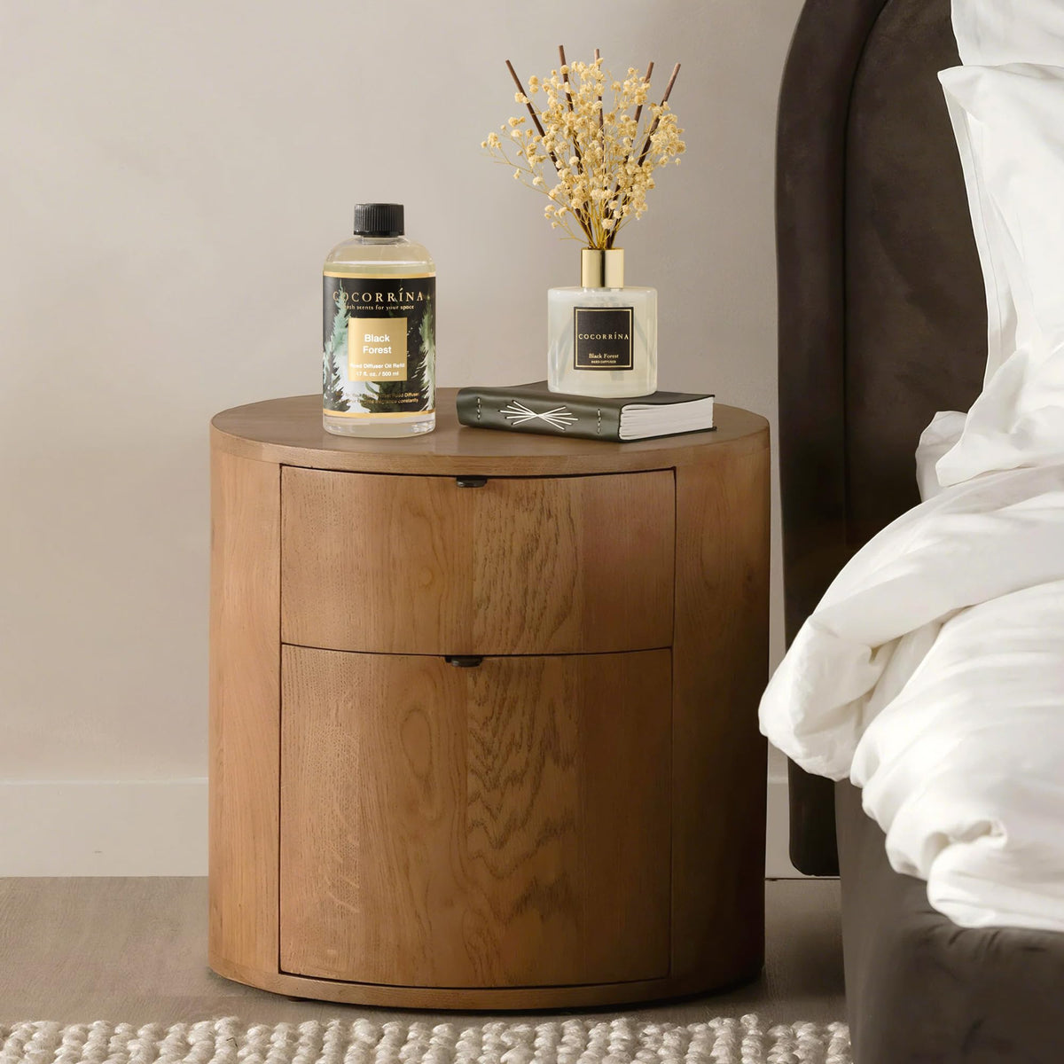 Cocorrína Black Forest diffuser in a cozy bedroom setup.