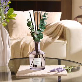 COCORRÍNA diffuser in a cozy bedroom setup for relaxation