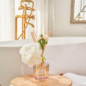 Compact diffuser fits on desks, nightstands, and bathroom shelves.