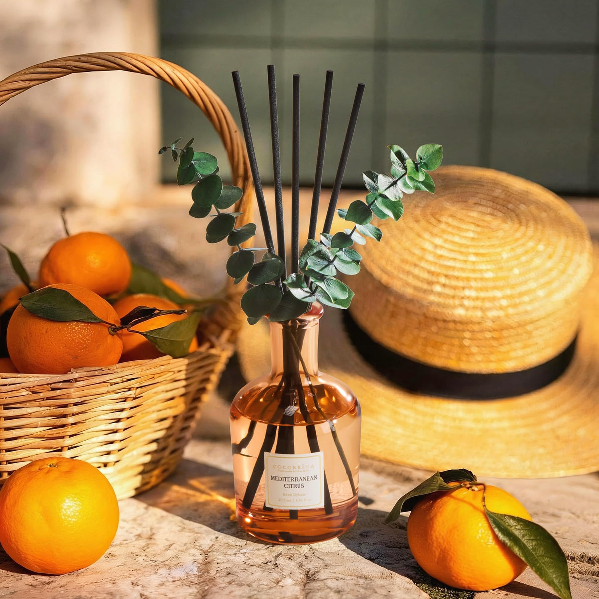 COCORRÍNA Mediterranean Citrus diffuser with eucalyptus sticks enhances decor and aroma.