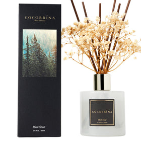 Cocorrína diffuser sticks in a living room setting releasing aroma for ambience
