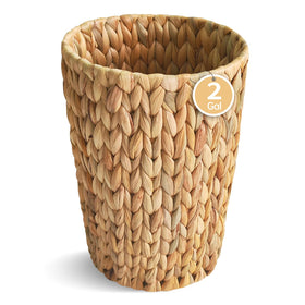 Coeusy wicker trash can in bathroom, round shape with compact, space-saving design.