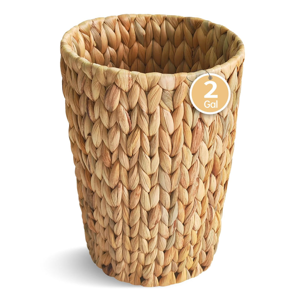 Coeusy wicker trash can in bathroom, round shape with compact, space-saving design.