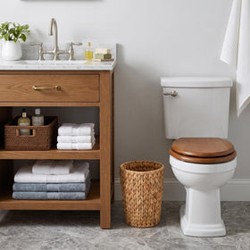 Coeusy wicker trash bin shows water hyacinth weave, lightweight yet durable for daily use.