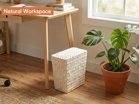 Coeusy wicker bin fits neatly in a bathroom corner
