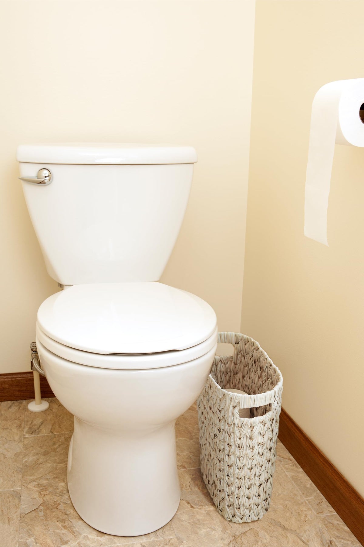 Coeusy wicker basket with handles, convenient disposal in tight spaces.