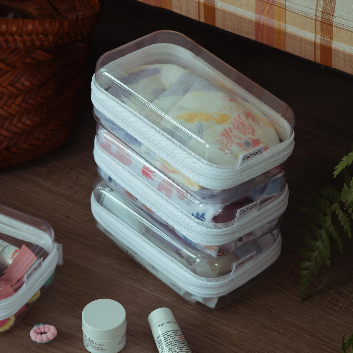 CoiiJoii zippered clear pouch front view, compact and stackable for desk essentials.