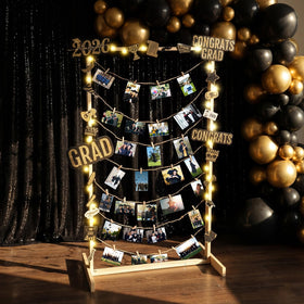 Colingmill wooden graduation stand with warm lighting showcasing cherished memories.