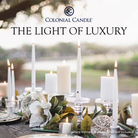 Colonial Candle ivory taper on an elegant table setting for ambiance