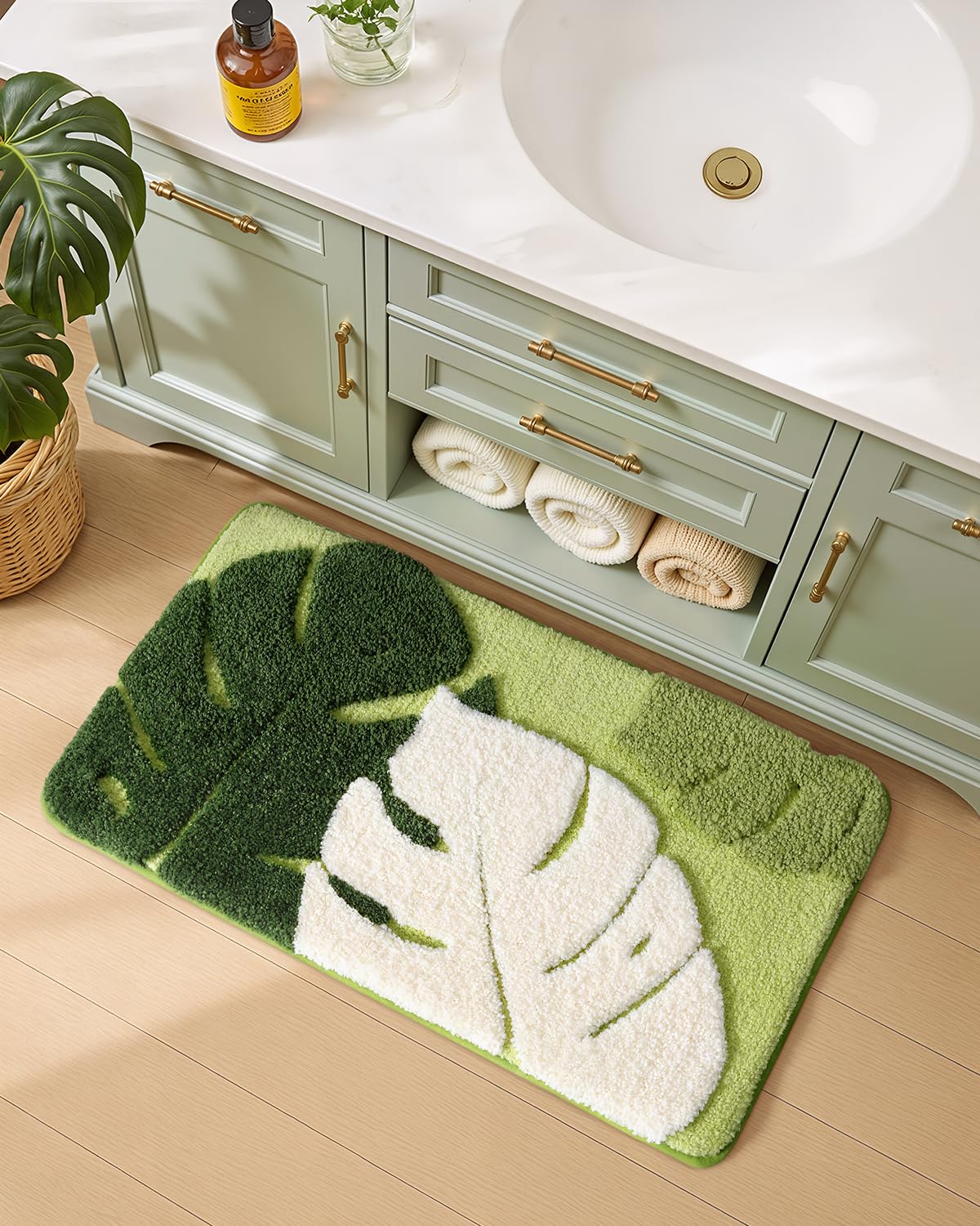 Color&Geometry monstera leaf pattern rug adds tropical style and easy cleaning.