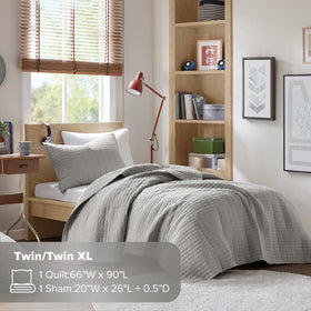 Care instructions for Comfort Spaces Kienna quilt set emphasizing machine washability.