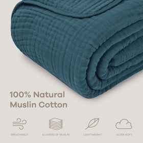 Comfy Cubs muslin blanket draped on bed boosts boho style with cozy feel.