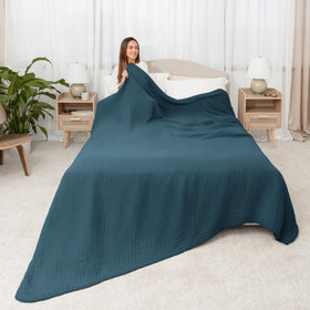 Comfy Cubs muslin blanket folded close-up shows plush texture and lightweight warmth.