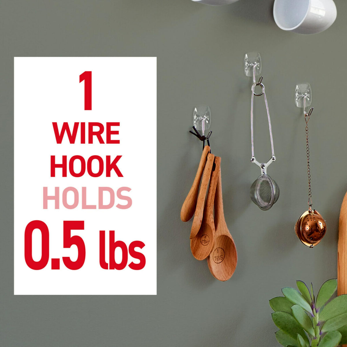 Command clear hook holding a hat demonstrates lightweight load capacity.