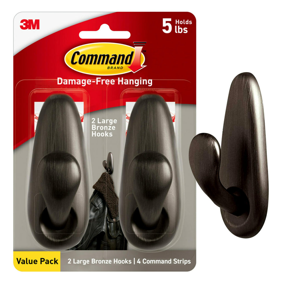 Command large metal hooks on wall holding items without damage.