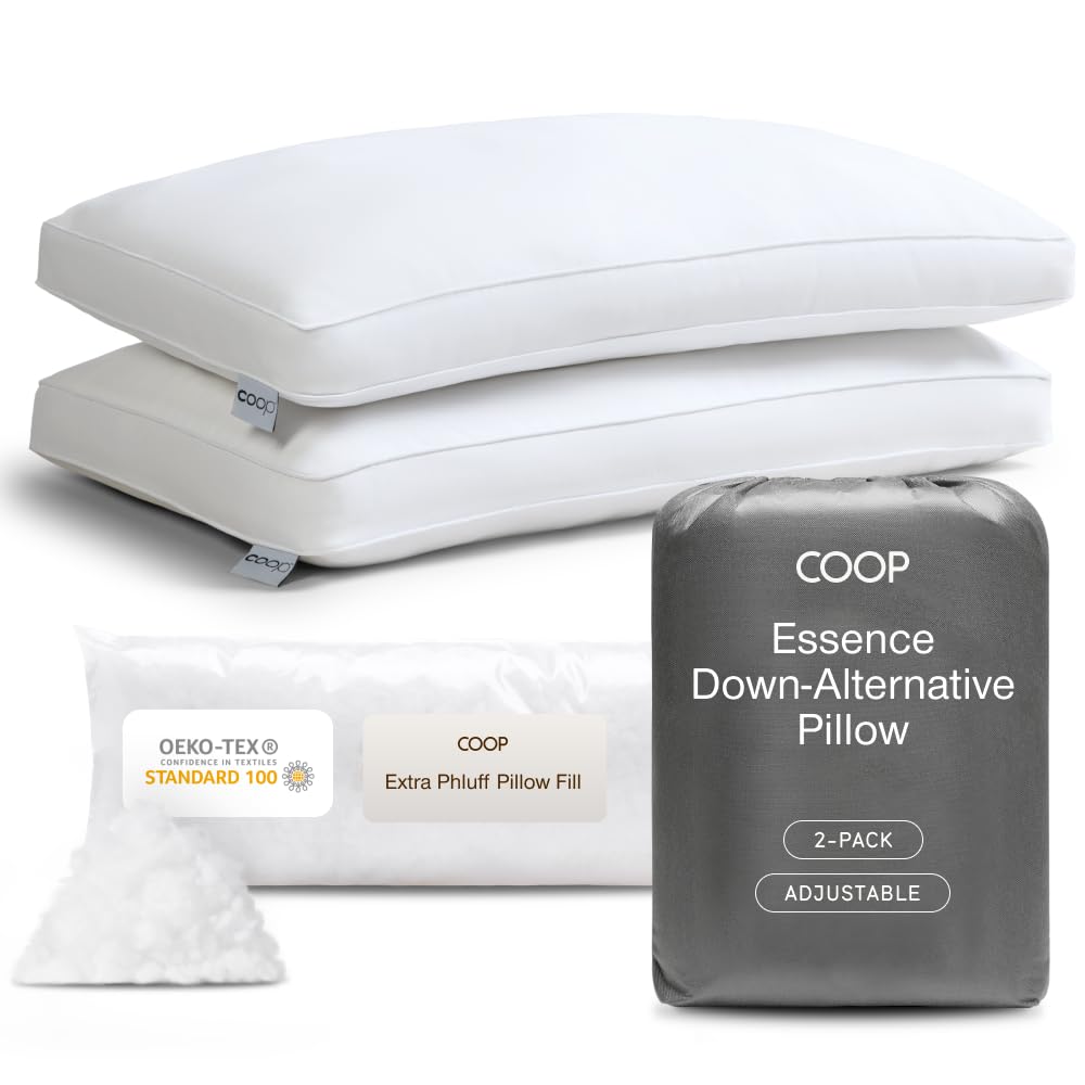 Coop Home Goods Essence Down Alternative Pillow 2-pack display sits on a bed.