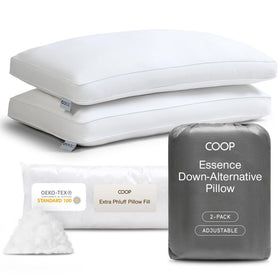 Coop Home Goods Essence Down Alternative Pillow 2-pack display sits on a bed.