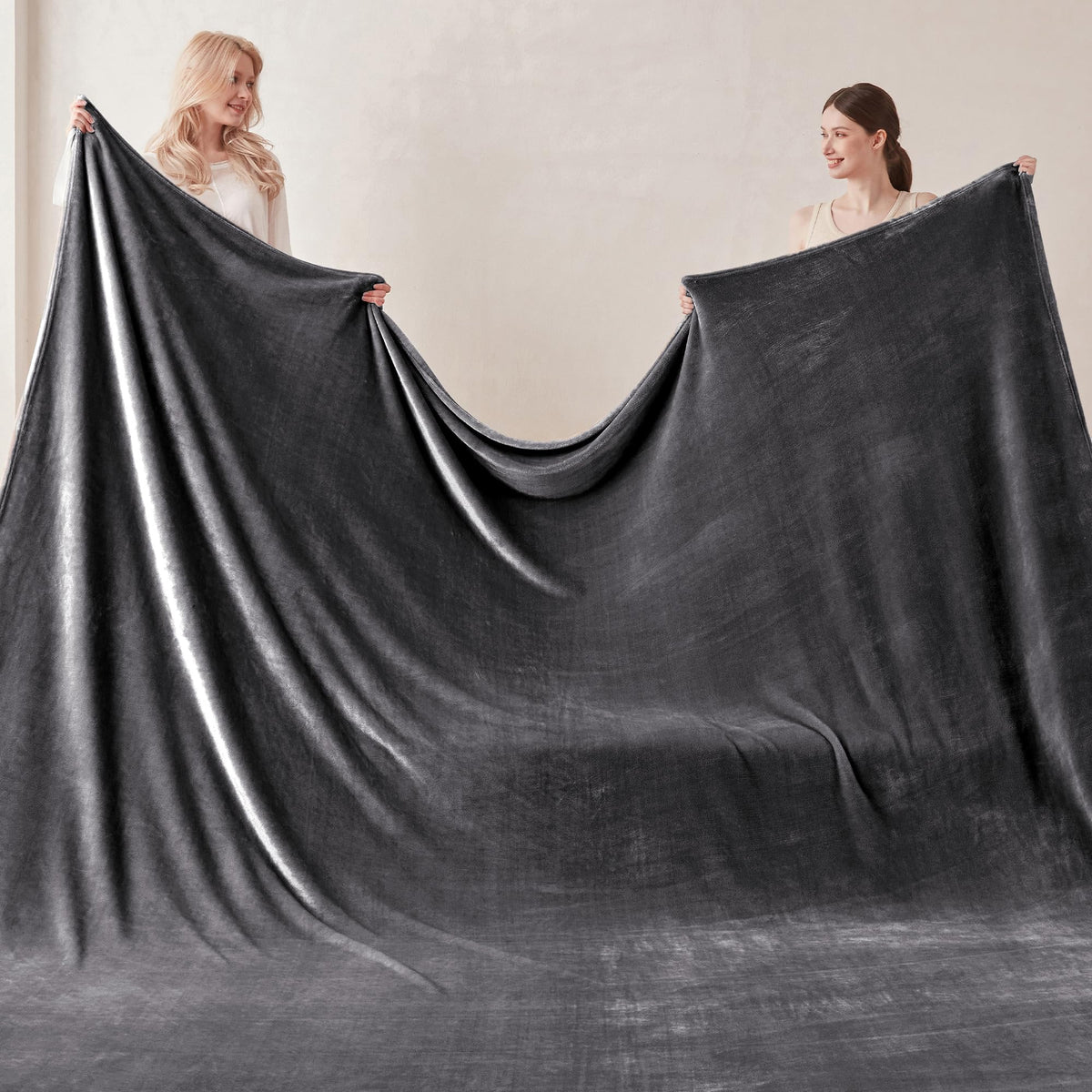 COOVA blanket on a sofa illustrating versatile lounging warmth.