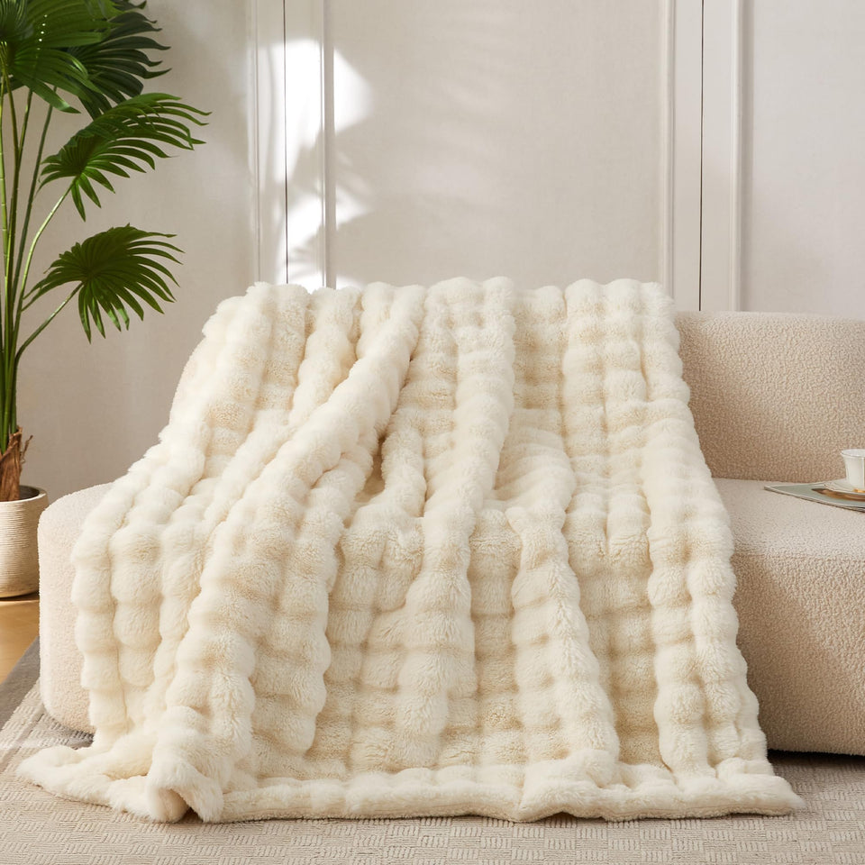COOVA faux fur throw blanket with bubble texture for luxurious warmth.