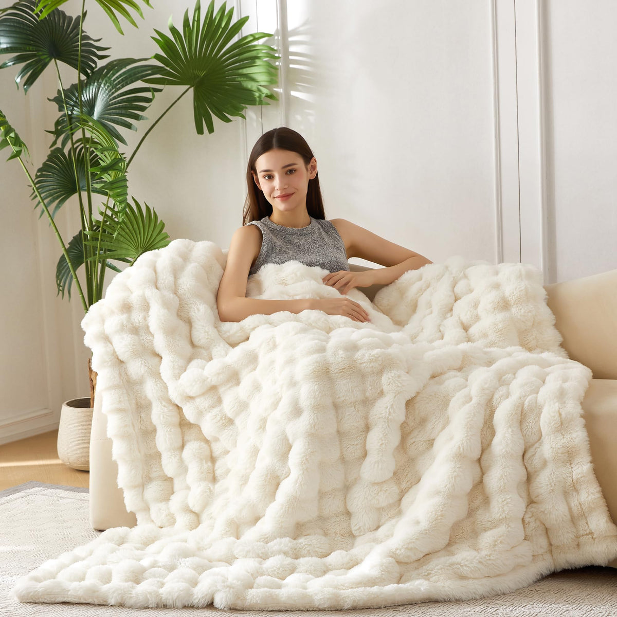 COOVA faux fur throw on couch showing soft surface for cozy lounging.