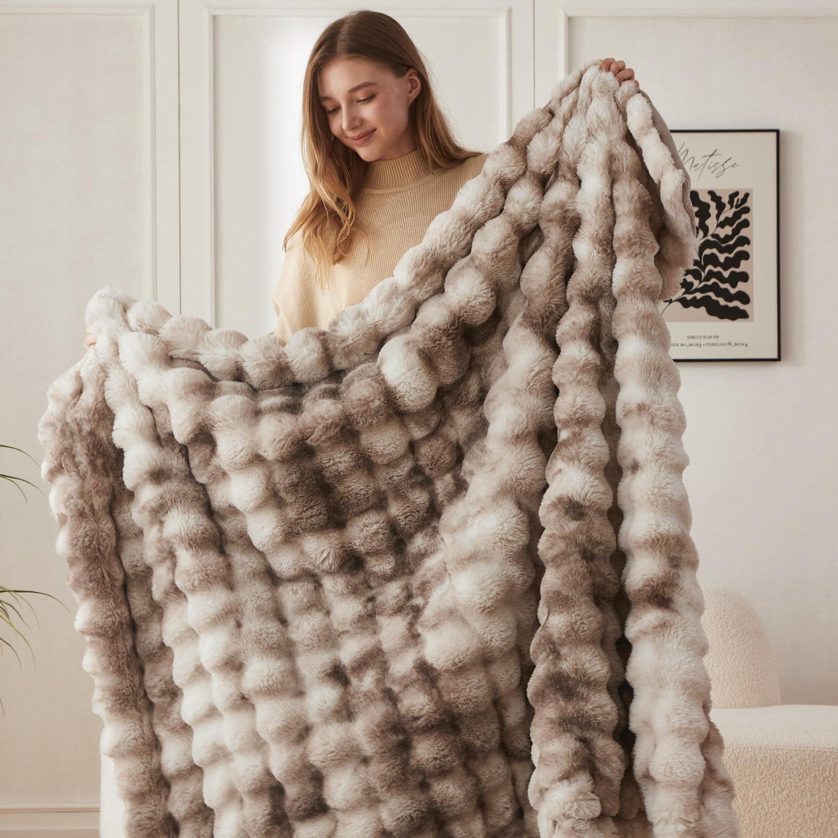 COOVA faux fur throw folded on a sofa shows plush fullness