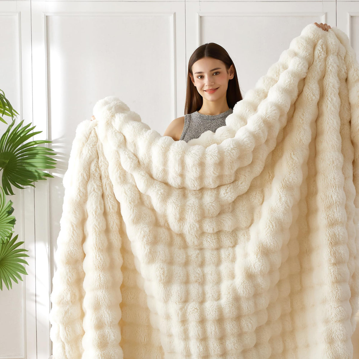 COOVA ivory white faux fur throw in a bedroom creating inviting ambiance.