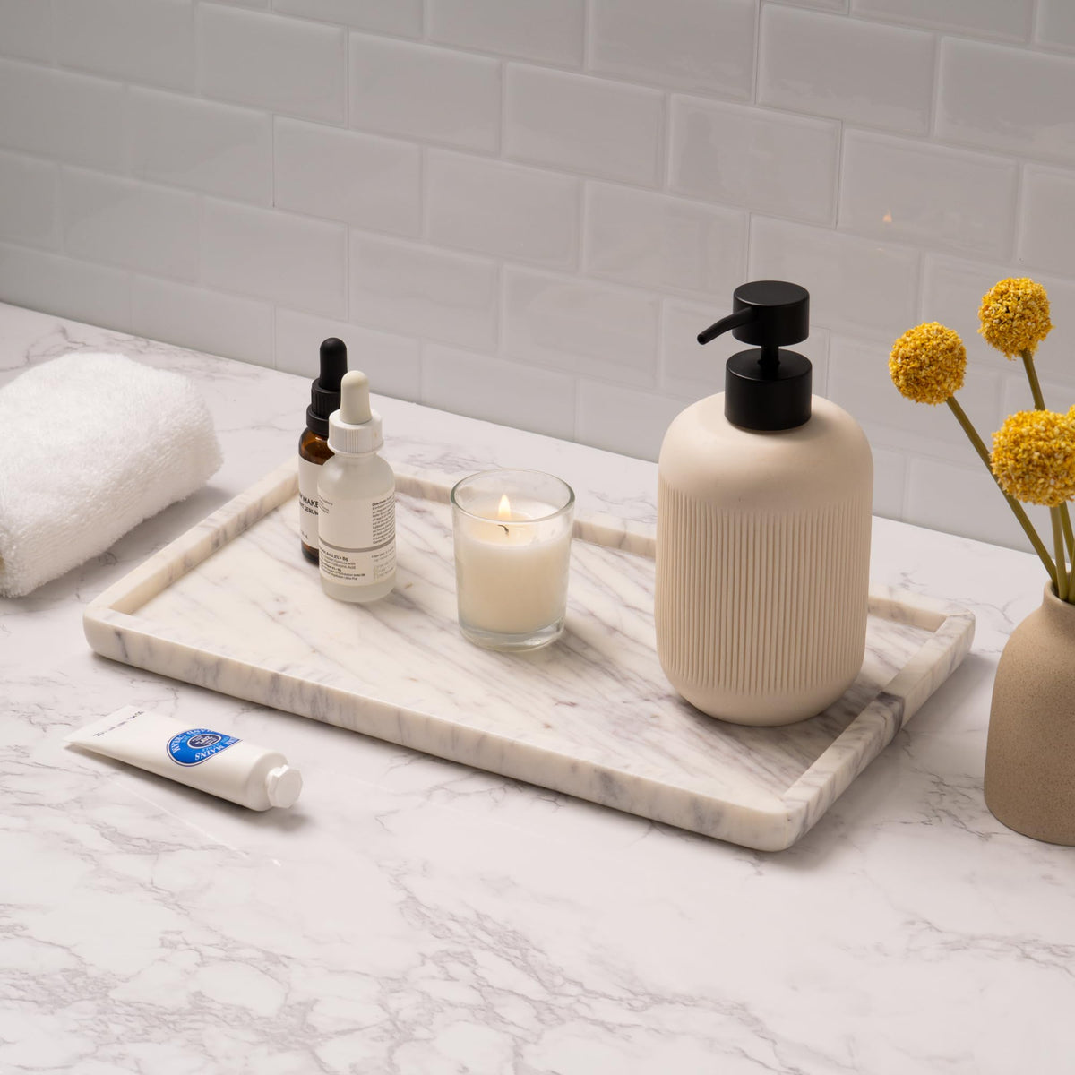 Cork & Mill marble tray on kitchen counter organizing bottles with style.
