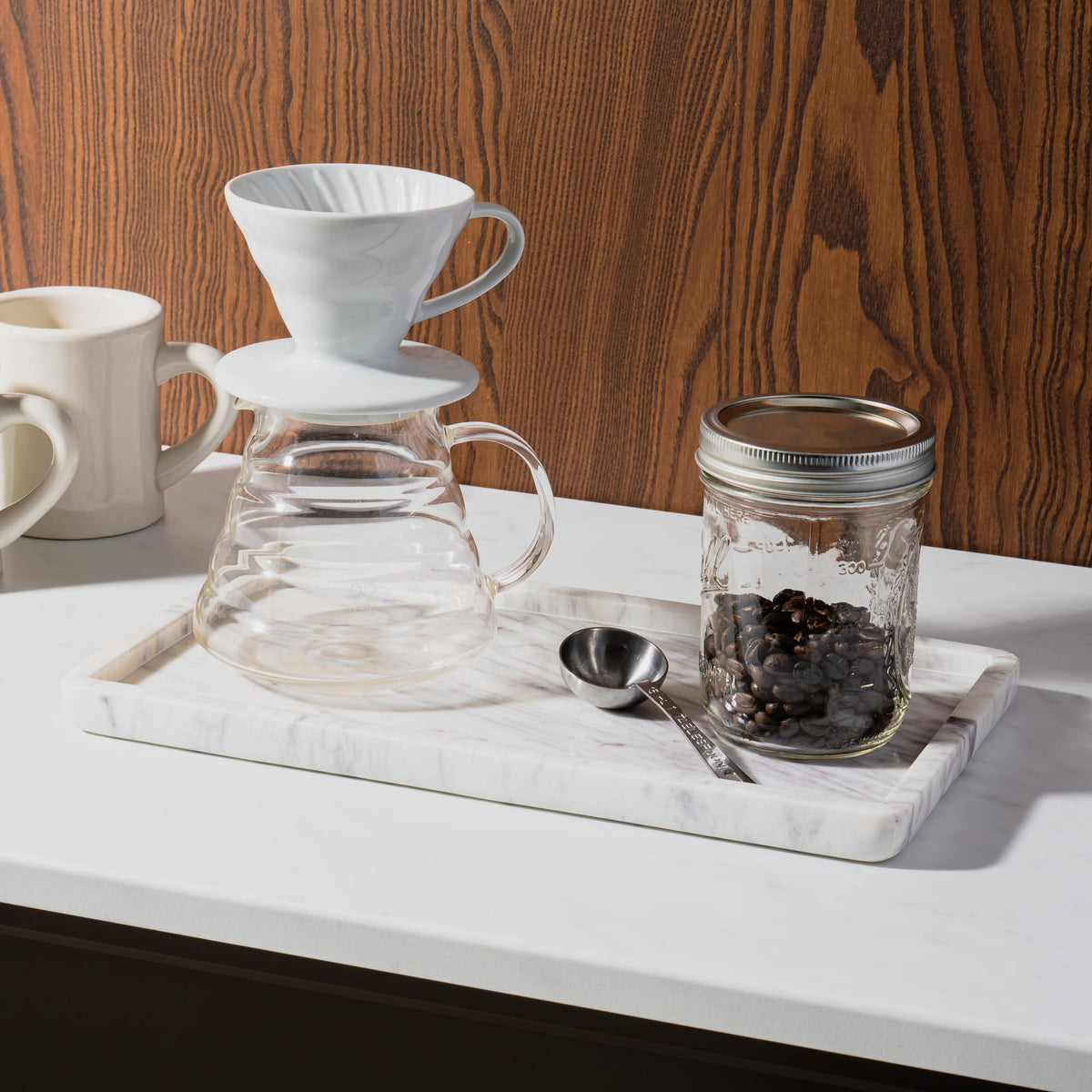 Cork & Mill marble tray holding soap dispensers for a tidy bathroom.