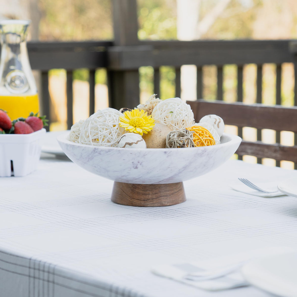Cork & Mill marble bowl on a dining table creates a modern focal point