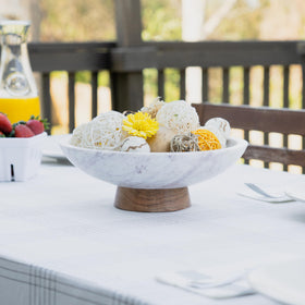 Cork & Mill marble bowl on a dining table creates a modern focal point