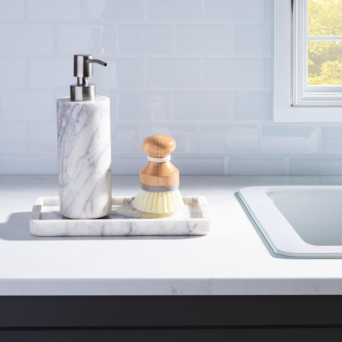 Cork & Mill marble dispenser for kitchen dish soap at the sink.