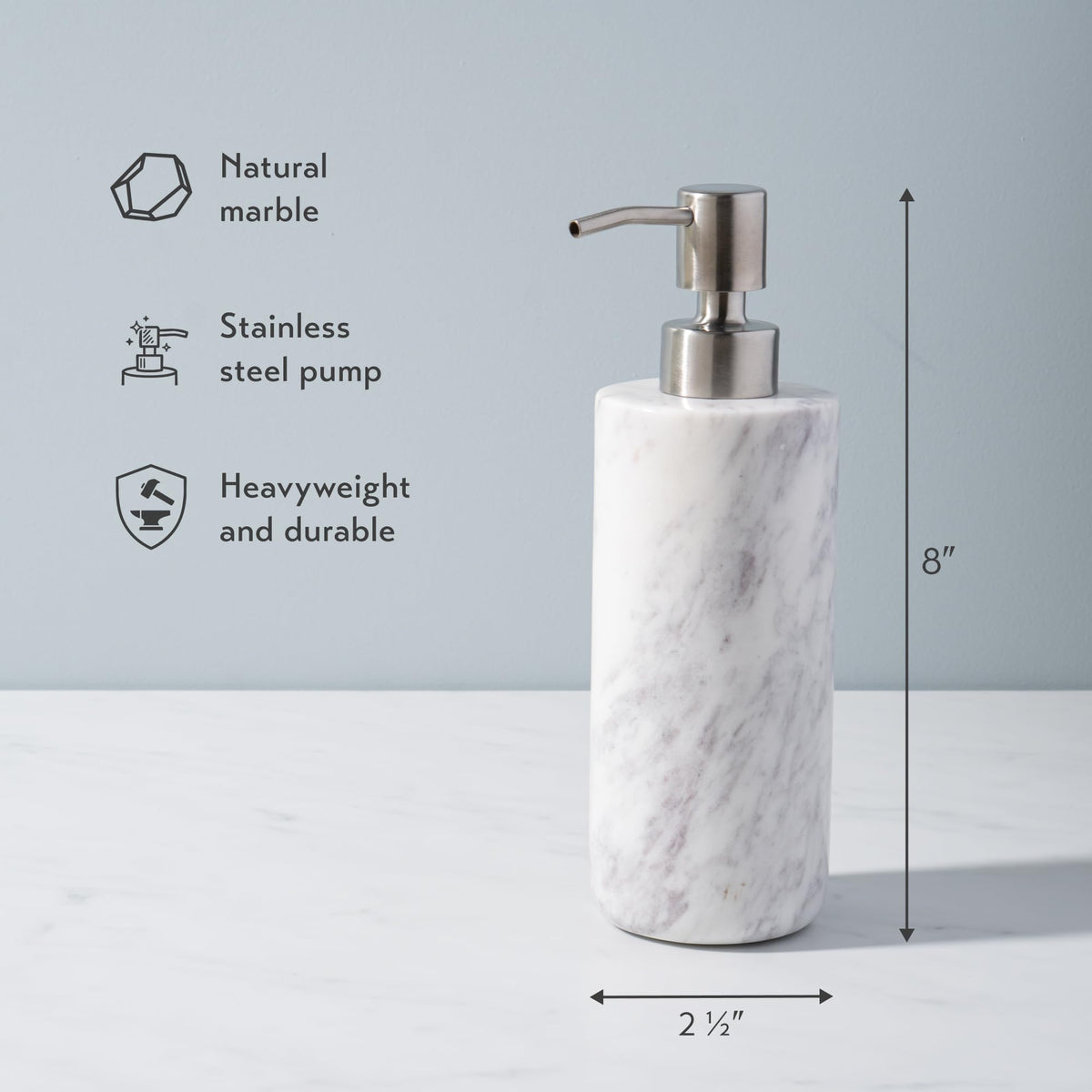 Cork & Mill marble dispenser on bathroom counter enhances modern decor.