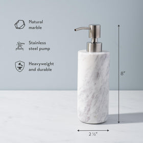 Cork & Mill marble dispenser on bathroom counter enhances modern decor.