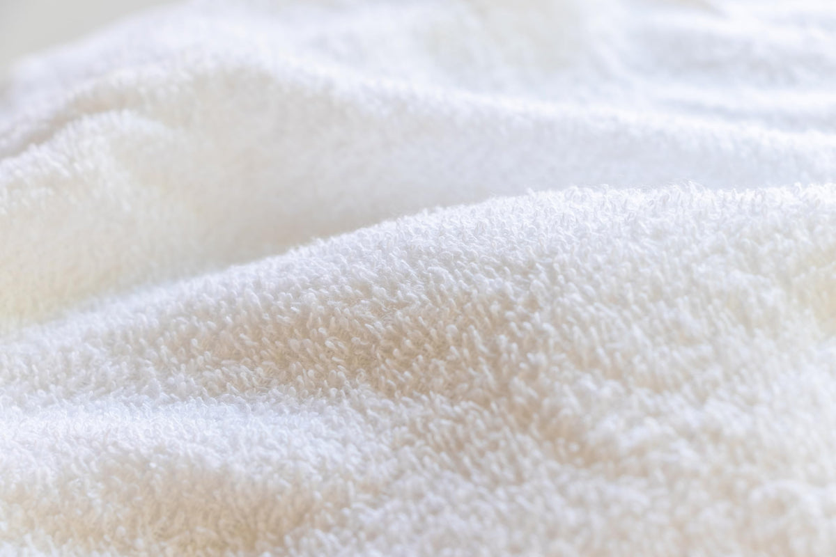 Close-up of CH cotton fibers emphasizing soft texture and absorbent performance.