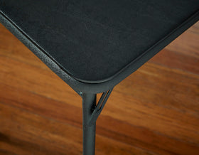 Cosco table suited for indoor and light outdoor spaces.