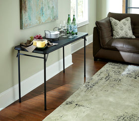Cosco folding table with black frame demonstrates non-marring leg tips protecting floors.