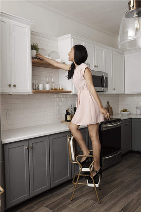 Cosco Stylaire gold steel frame with cream upholstery for a nostalgic look