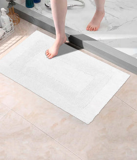 Cotton Craft easy-care bath mats, machine washable for busy homes.