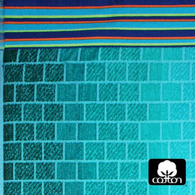 Cotton Craft Malibu towel close-up showing vibrant blue tiles print and plush softness