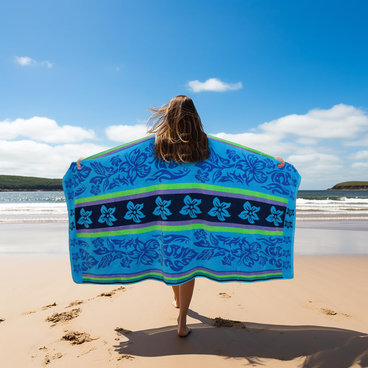 Cotton Craft towel spread on sand, offering full coverage for sunbathing.