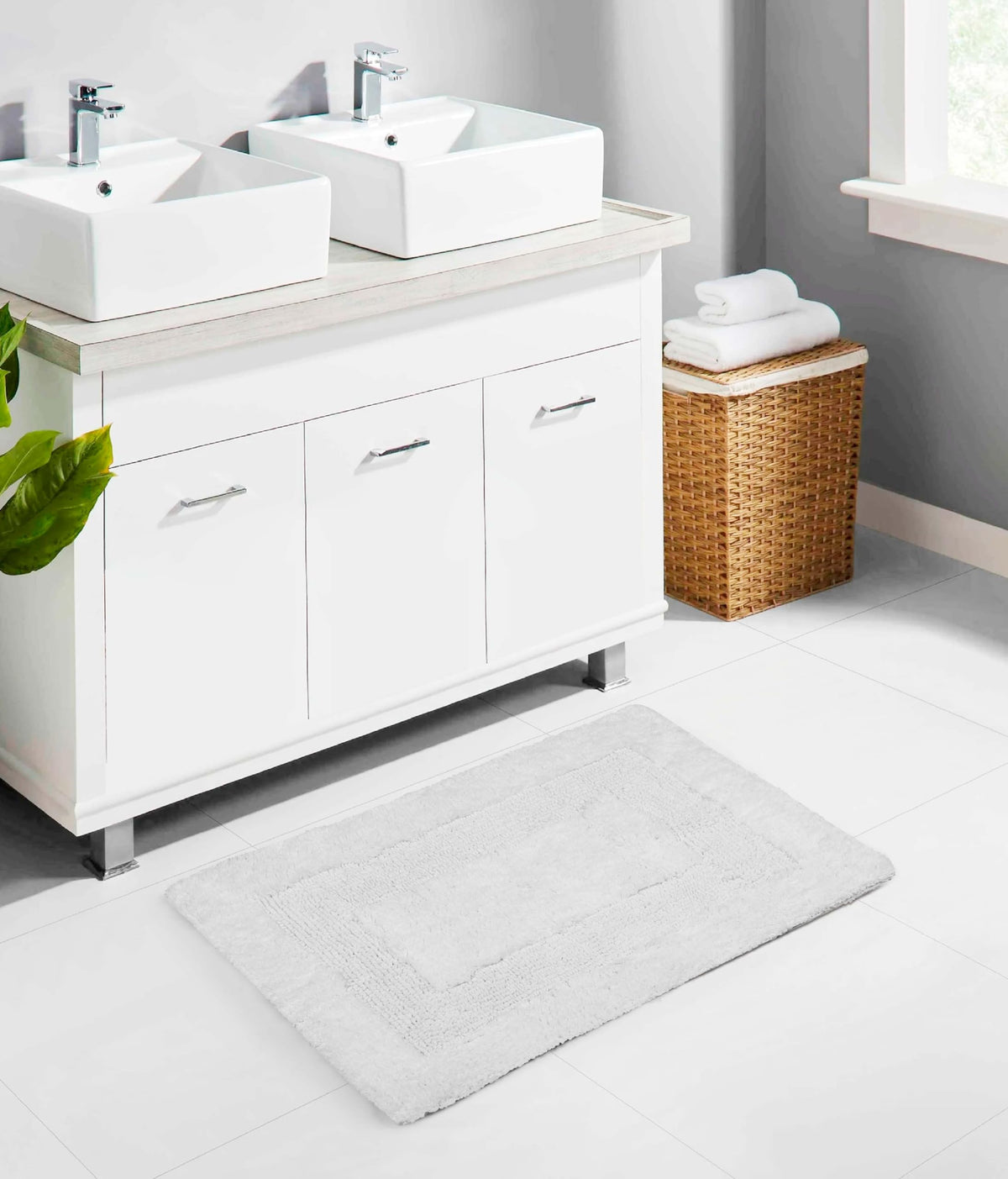 Cotton Craft 17x24 white bath mat, two-sided plush texture for comfort.
